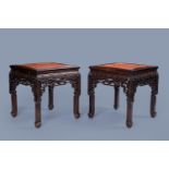 A pair of Chinese wood side tables with marble top, 20th C.