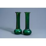 A pair of Bohemian Art Nouveau style iridescent green glass vases, 20th C.