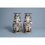 A pair of Chinese Nanking crackle glazed famille rose vases with warrior scenes, 19th/20th C.