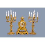 A French 'Style Transition' gilt bronze three-piece clock garniture, late 19th C.
