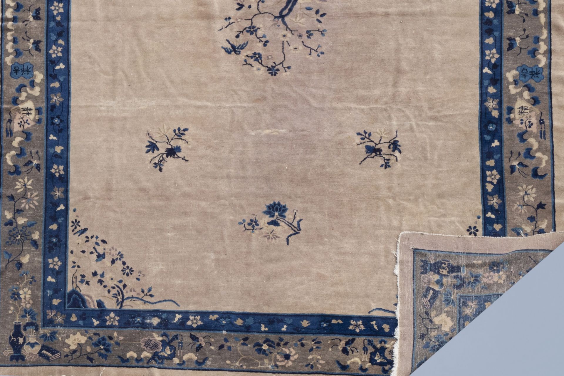 A Chinese 'Peking' rug with floral design, wool on cotton, first half of the 20th C. - Image 3 of 3