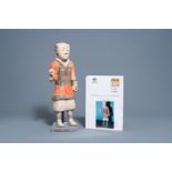 A Chinese polychrome painted pottery figure of a standing attendant, Han