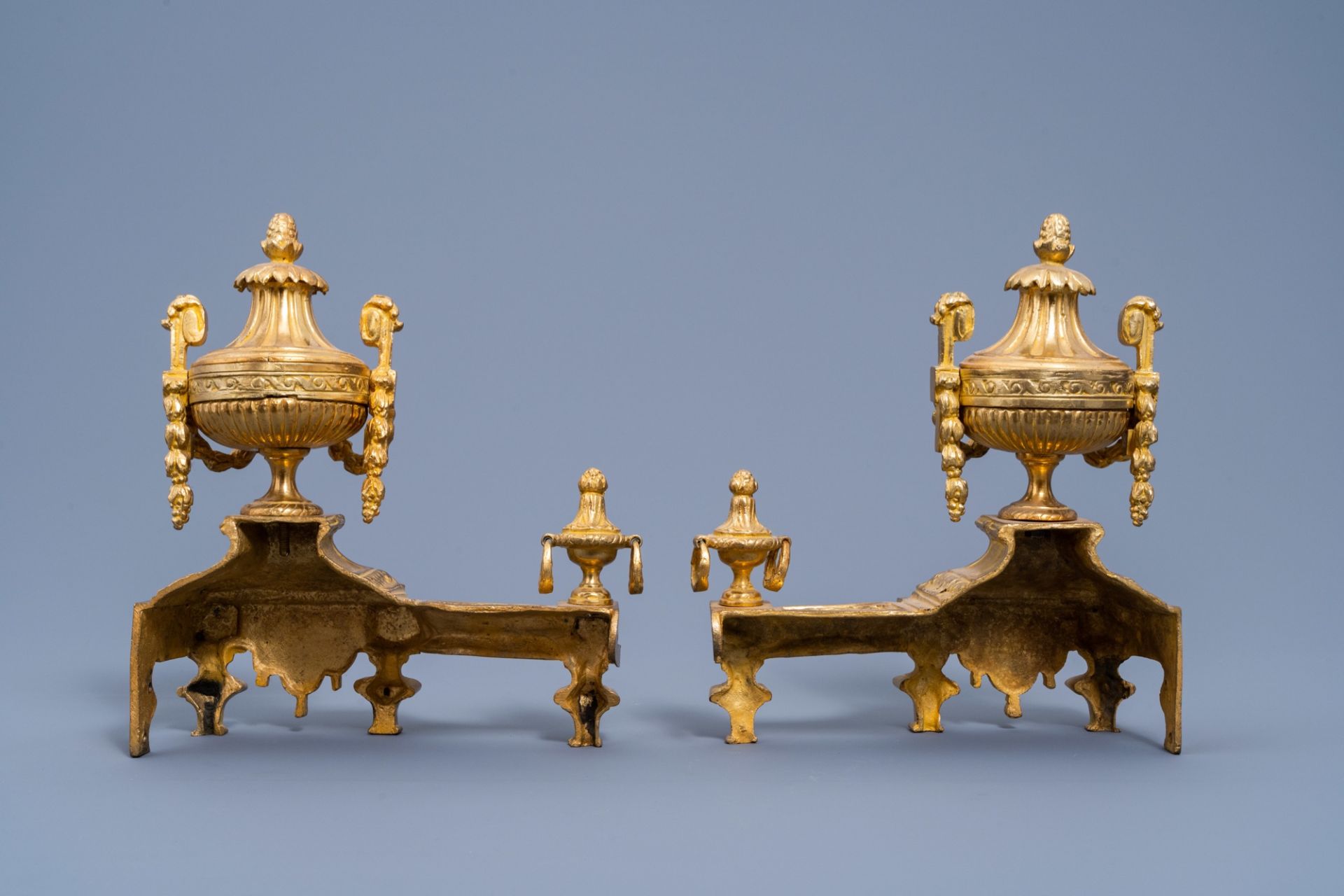 A pair of French Louis XVI style gilt bronze chenets and fire fender, 19th/20th C. - Image 5 of 11