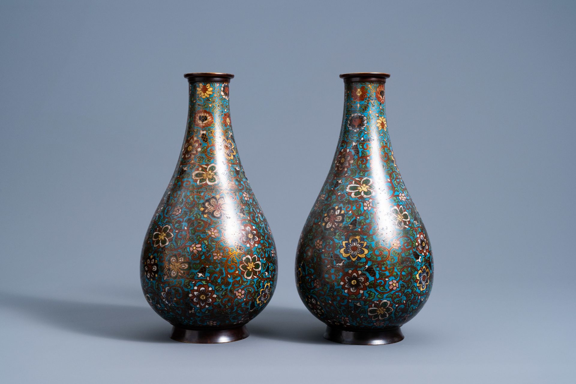 A pair of Chinese bottle shaped cloisonnŽ vases with floral design, 19th/20th C. - Image 2 of 6