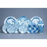 A varied collection of Chinese blue and white plates and chargers and a vase with figurative design