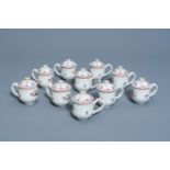 Ten Chinese famille rose cream cups and covers with twisted handles and floral design, Qianlong