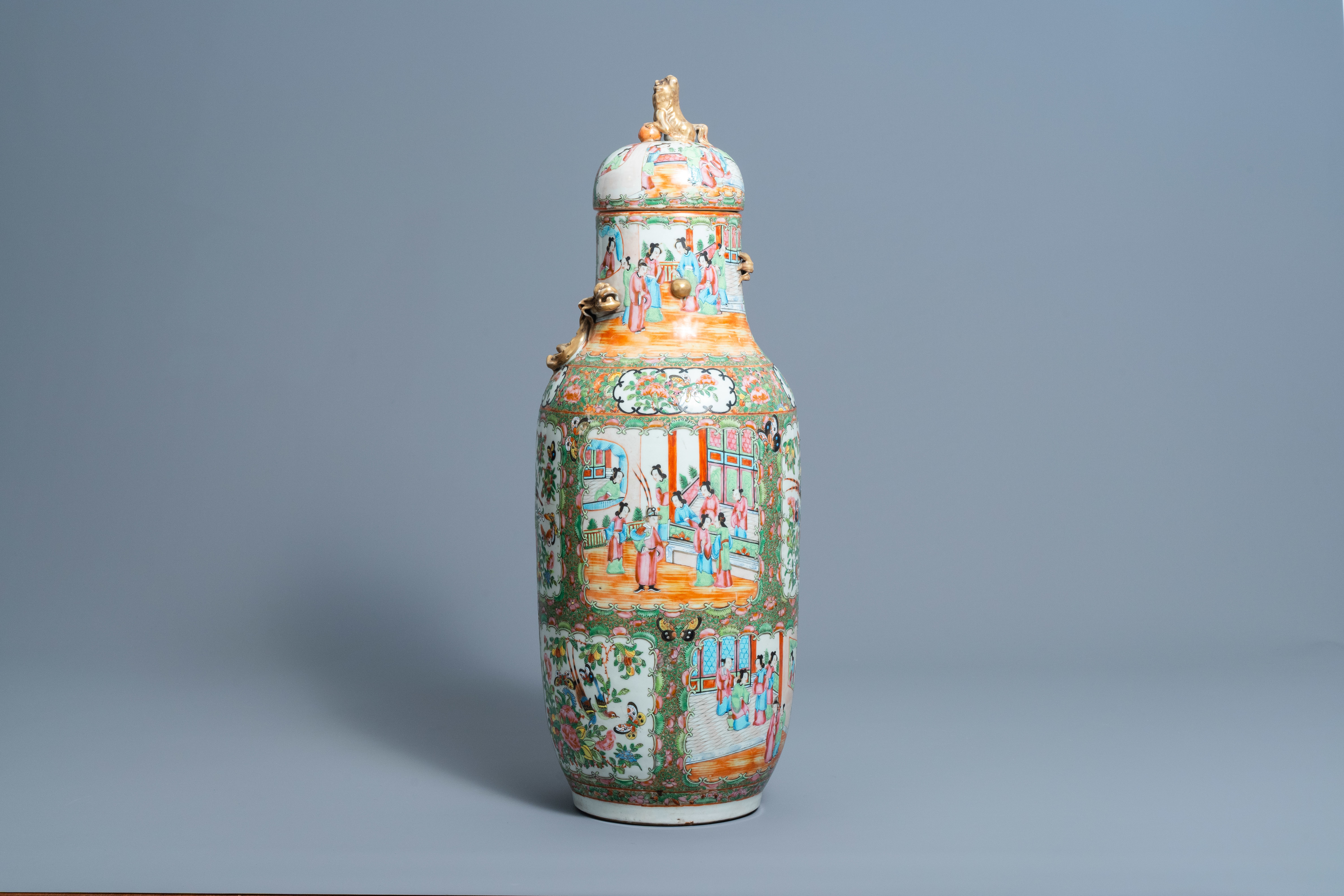 A Chinese Canton famille rose vase and cover with dragon relief design, 19th C.