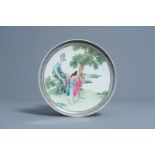 A Chinese famille rose plate with ladies in a garden, 20th C.