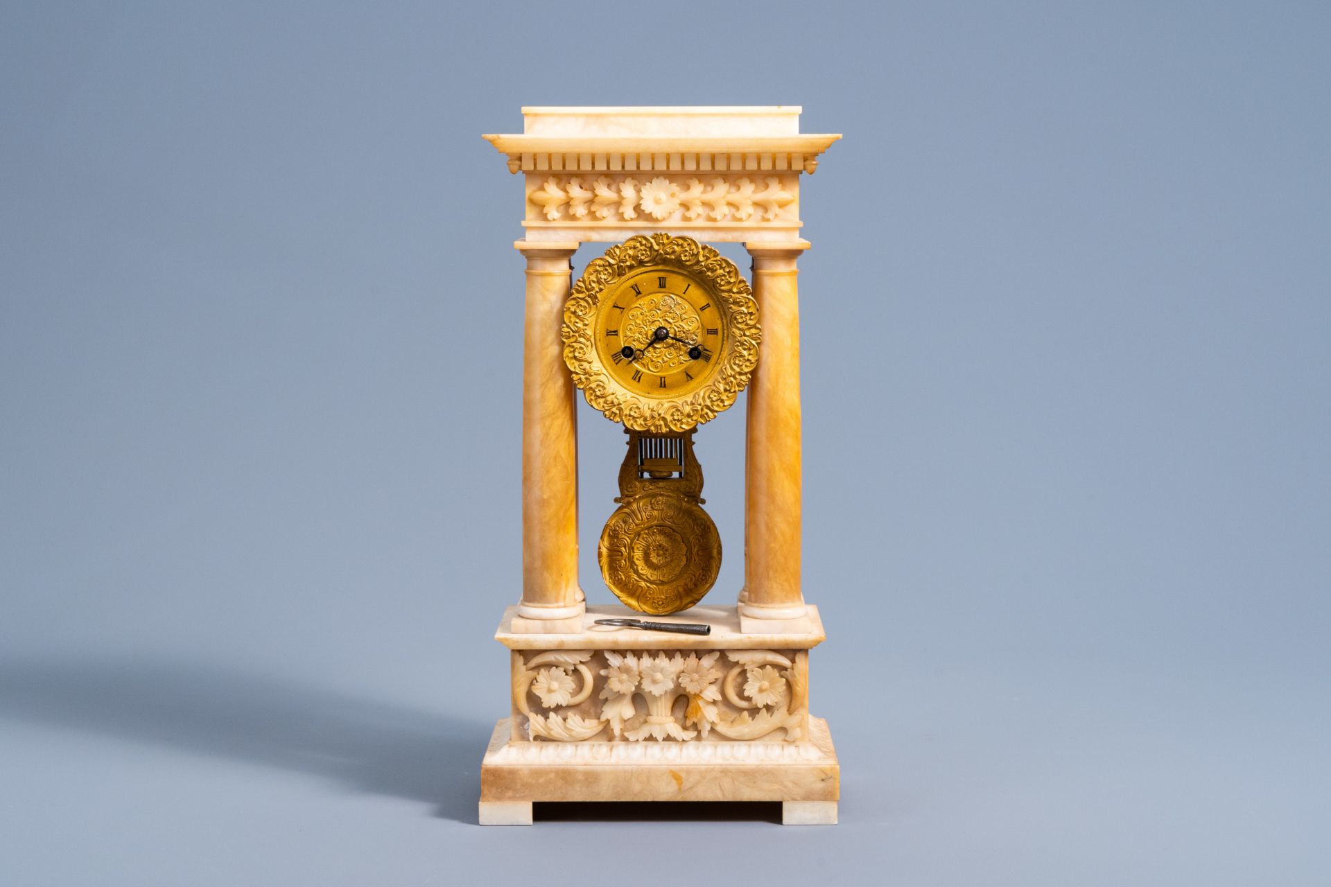 A French bronze and alabaster column mantel clock with floral design, 19th C. - Image 2 of 11