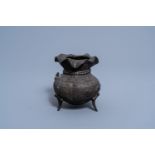 A Chinese bronze tripod vase, Qing