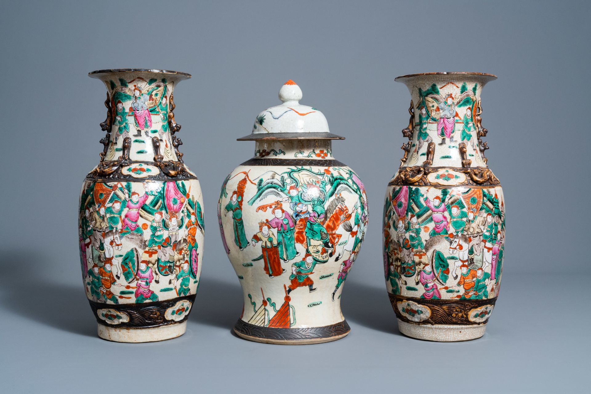 A pair of Chinese Nanking crackle glazed famille rose vases and a vase and cover with warrior scenes - Image 4 of 7