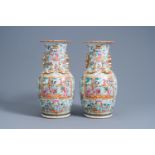 A pair of Chinese Canton famille rose vases with palace scenes, 19th C.