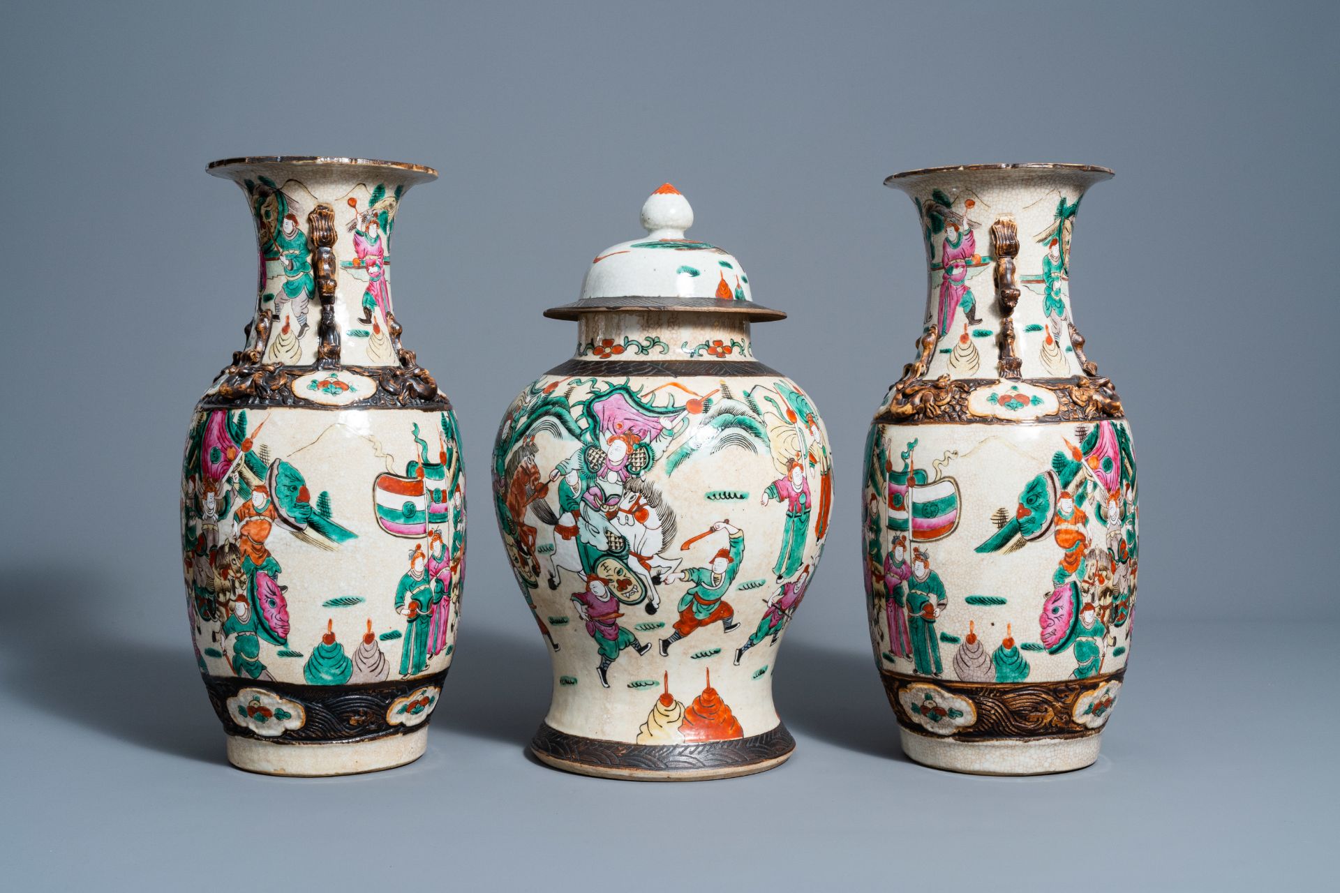 A pair of Chinese Nanking crackle glazed famille rose vases and a vase and cover with warrior scenes - Image 5 of 7