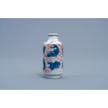 A Chinese blue, white and copper red 'animals' snuff bottle, Yongzheng mark, 20th C.