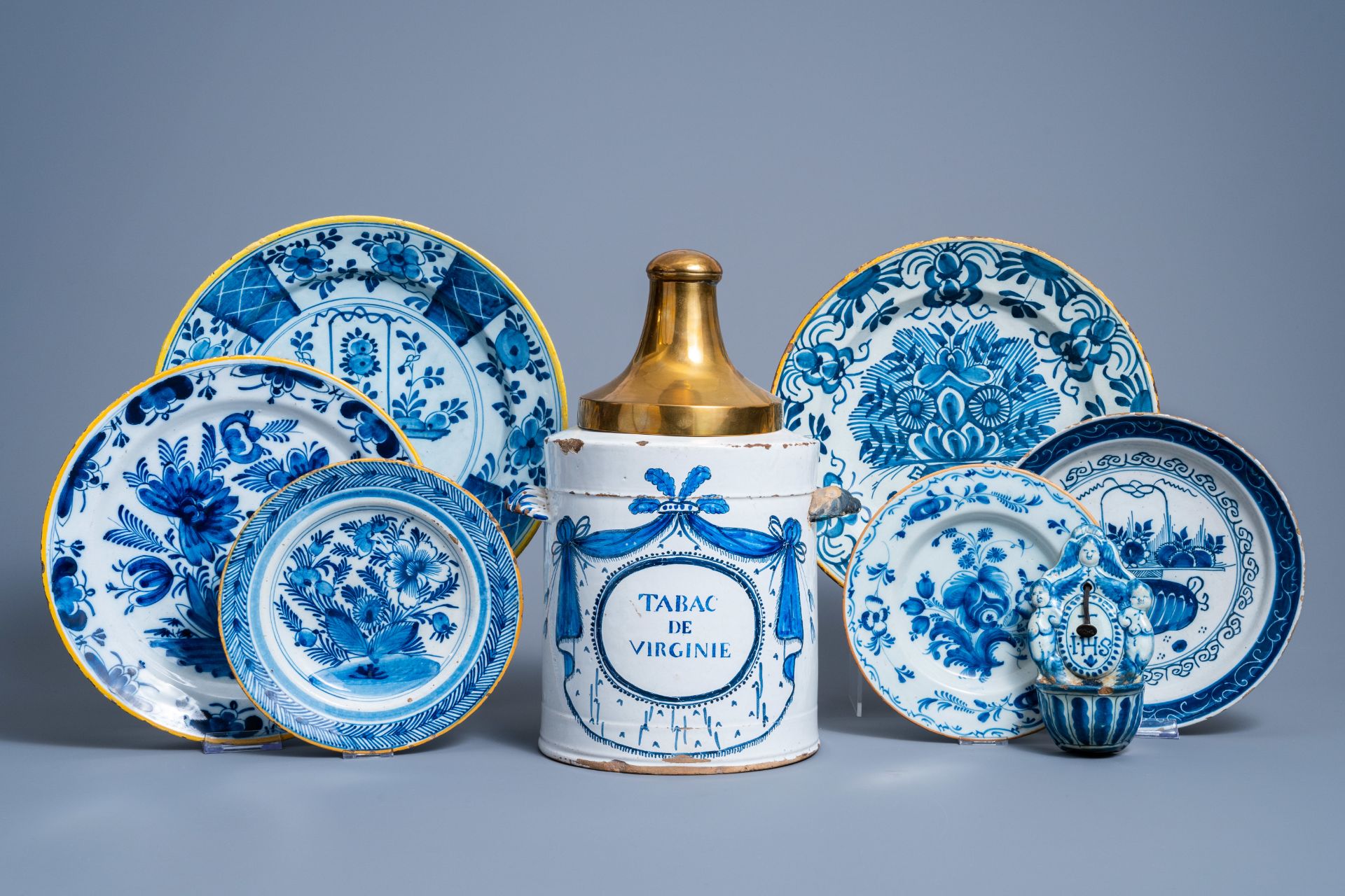 A Brussels blue and white tobacco jar, six Dutch Delft plates with floral design and a holy water fo - Image 2 of 14