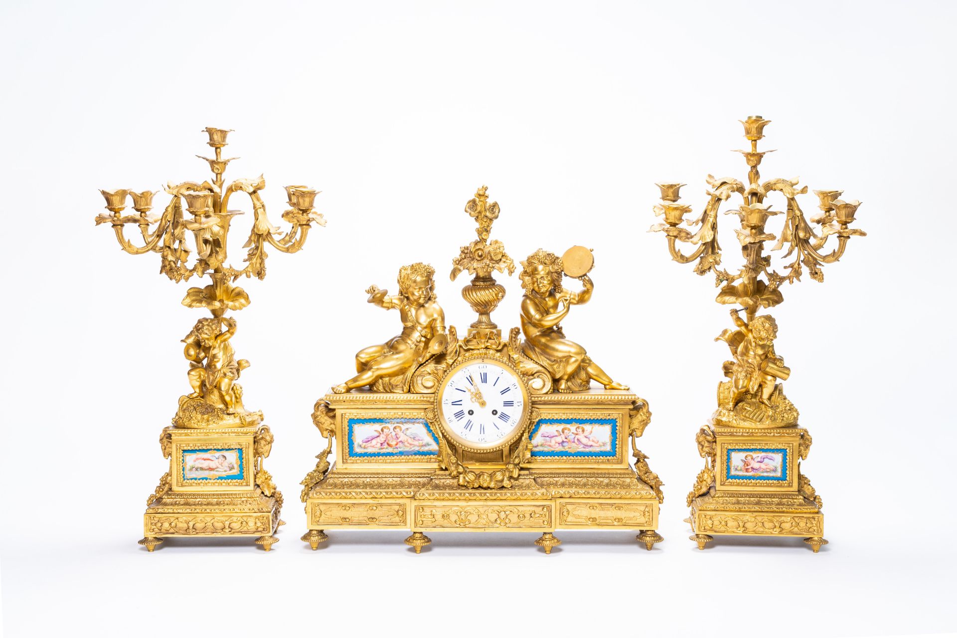 A French gilt bronze three-piece clock garniture with musicians and Svres style plaques, 19th C. - Image 2 of 21