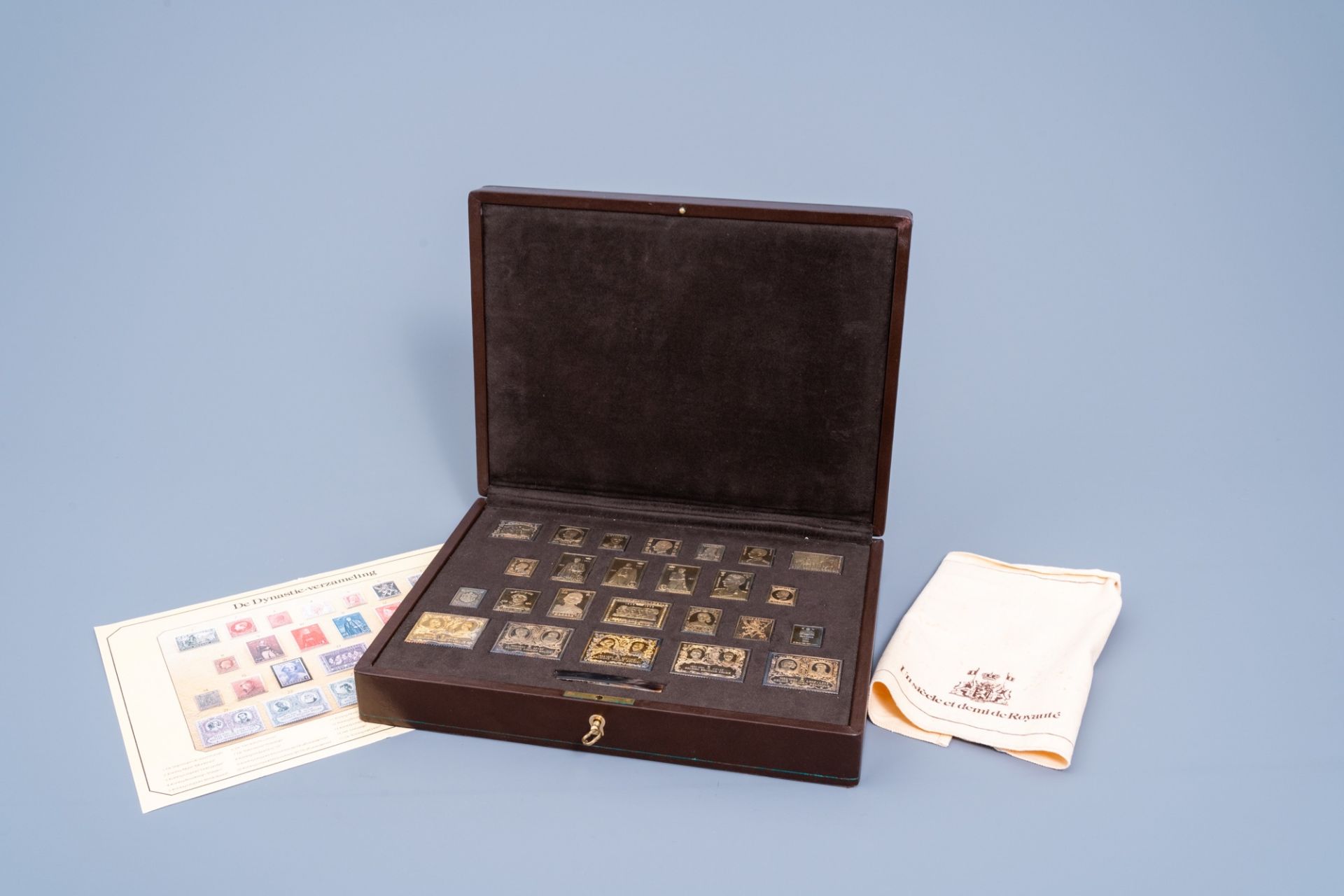 A collection of 25 Belgian silver-gilt stamps with matching case, the 'Dynastie-verzameling', 925/00