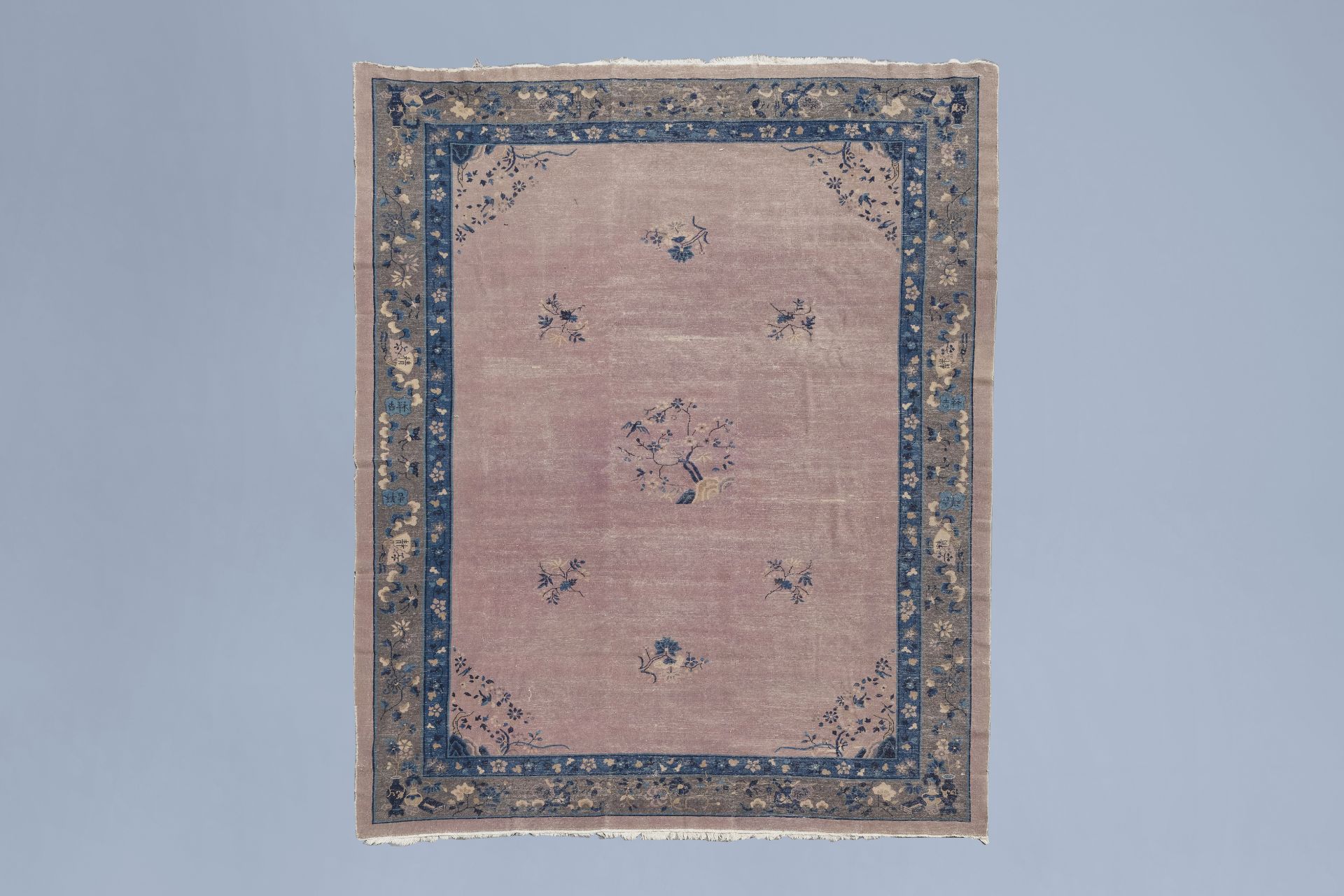 A Chinese 'Peking' rug with floral design, wool on cotton, first half of the 20th C. - Image 2 of 3
