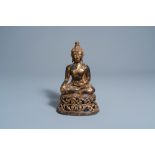 A gilt-lacquered bronze figure of Buddha Shakyamuni on a reticulated lotus throne, probably Thailand