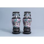 A pair of Chinese Nanking crackle glazed famille rose vases with warrior scenes on bronze lotus shap