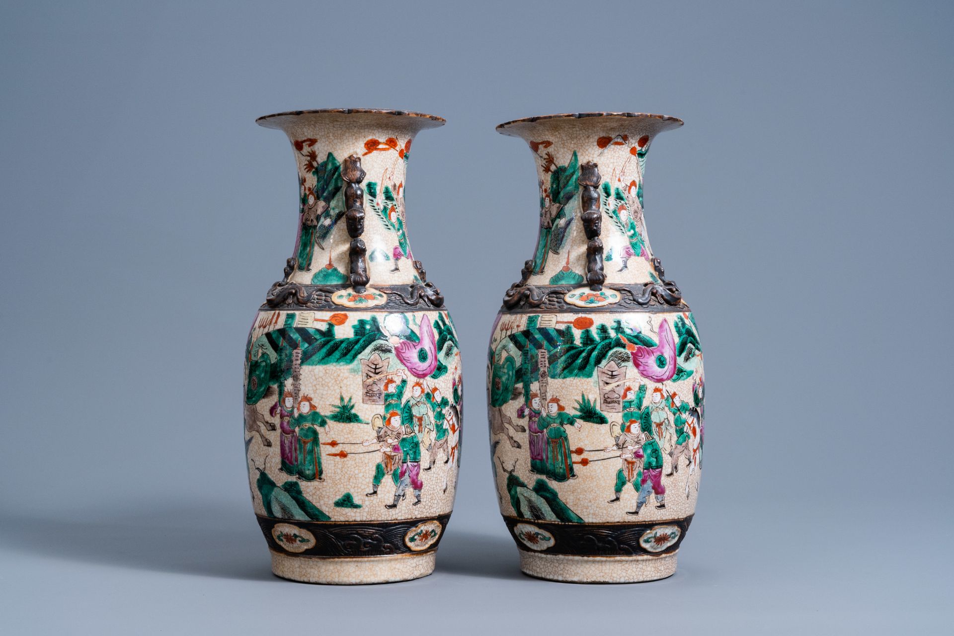 A pair of Chinese Nanking crackle glazed famille rose vases with warrior scenes, 19th C. - Image 2 of 6