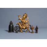 A Sino-Tibetan gilt bronze figure of Mahakala on horseback, a bronze bell and three various Indian s