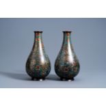 A pair of Chinese bottle shaped cloisonnŽ vases with floral design, 19th/20th C.