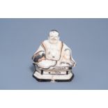 A Chinese Cizhou glazed figure of the laughing Buddha or Budai, probably Ming