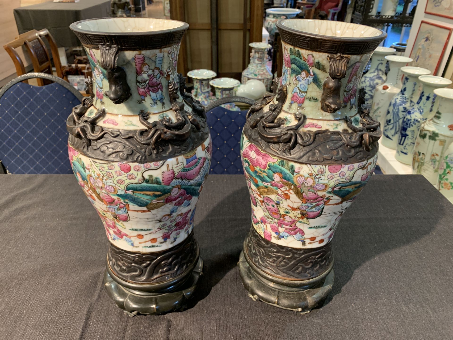 A pair of Chinese Nanking crackle glazed famille rose vases with warrior scenes on bronze lotus shap - Image 8 of 11