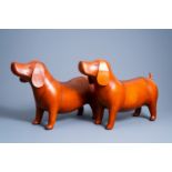 A pair of leather dog ottomans in the manner of Dimitri Omersa (1927-1975), 20th C.