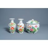 Two Chinese qianjiang cai vases and a jar and cover with a bird among blossoming branches, 19th/20th
