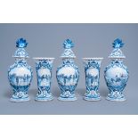 A five-piece Dutch Delft blue and white vase garniture with ice skaters, 19th C.