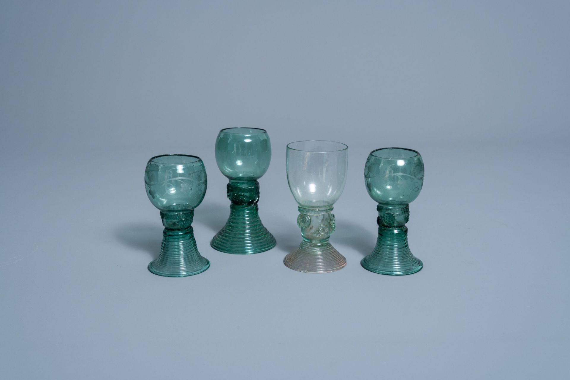 Four Dutch waldglas roemers with raspberry prunts, two of which decorated with grapevines, 18th/19th