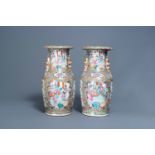 A pair of Chinese Canton famille rose vases with palace scenes, 19th C.