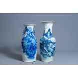Two Chinese blue and white vases with a phoenix among blossoming branches and an animated landscape,