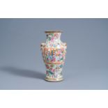 A Chinese Canton famille rose baluster vase with palace scenes, 19th C.