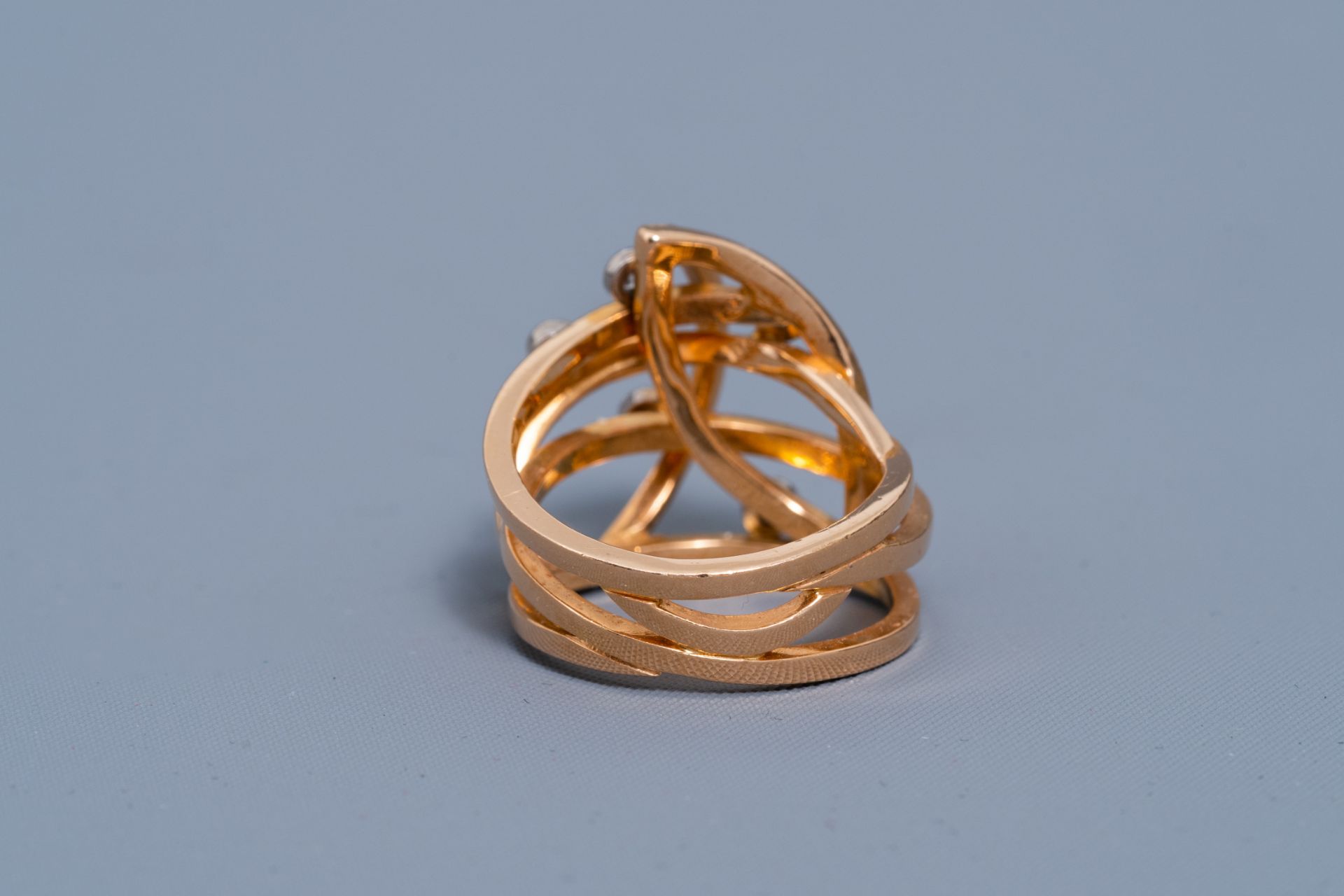 An 18 carat yellow and white gold ring set with six diamonds, 20th C. - Image 2 of 7