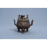 A Chinese bronze tripod censer and cover, Xuande mark, Ming