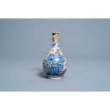 A clobbered Chinese blue and white vase with birds among flowers, Kangxi