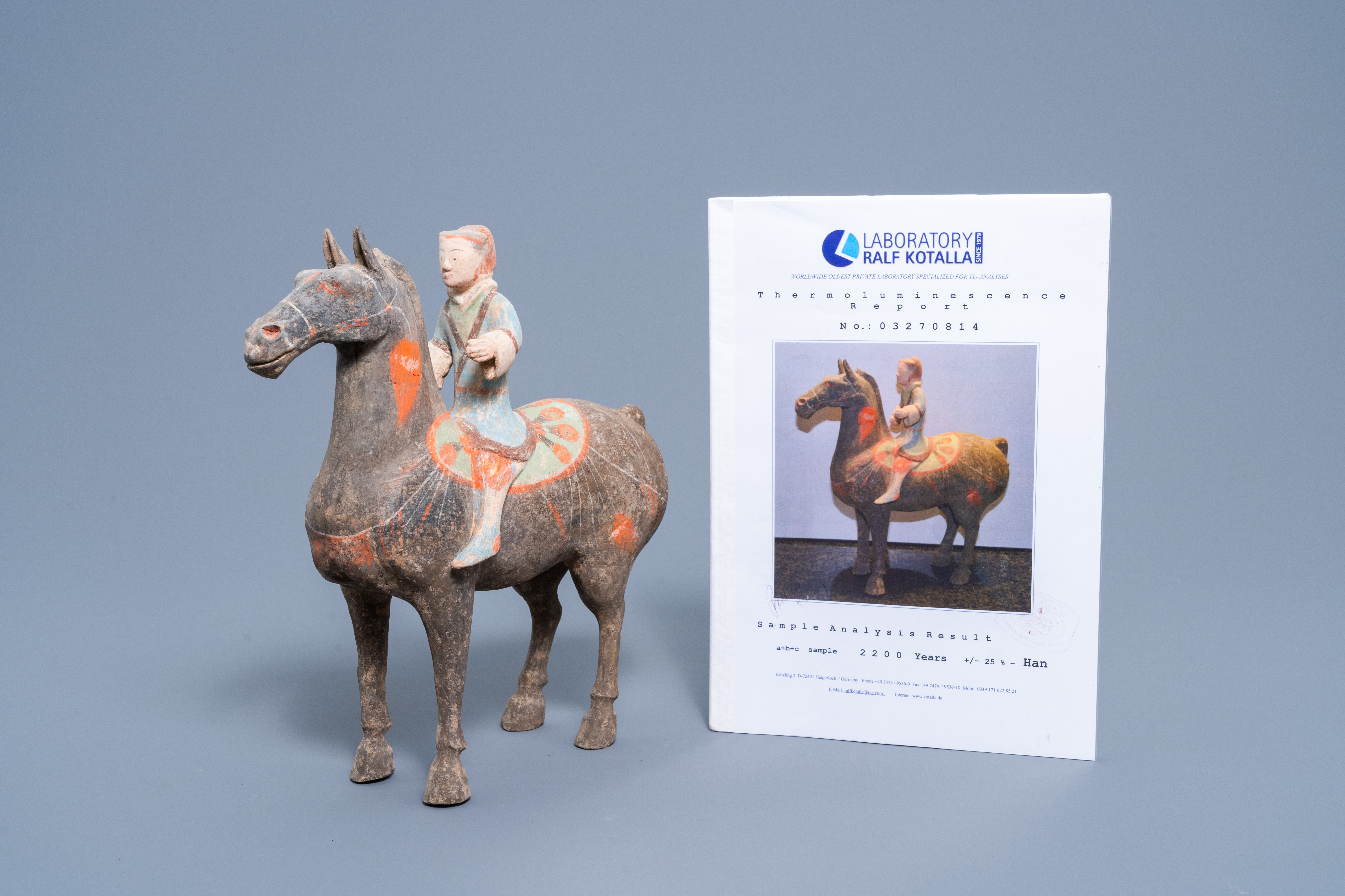 A Chinese polychrome painted pottery equestrian figure, Han