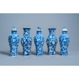 A Chinese blue and white prunus on cracked ice ground five-piece garniture, 19th C.
