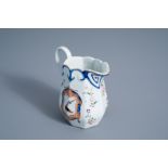 A Chinese famille rose English market export porcelain armorial jug with floral design, Qianlong/Jia