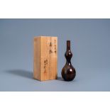 A Japanese bronze double gourd vase with flamed brown patina, Yoshida Kazumas, Showa, 20th C.