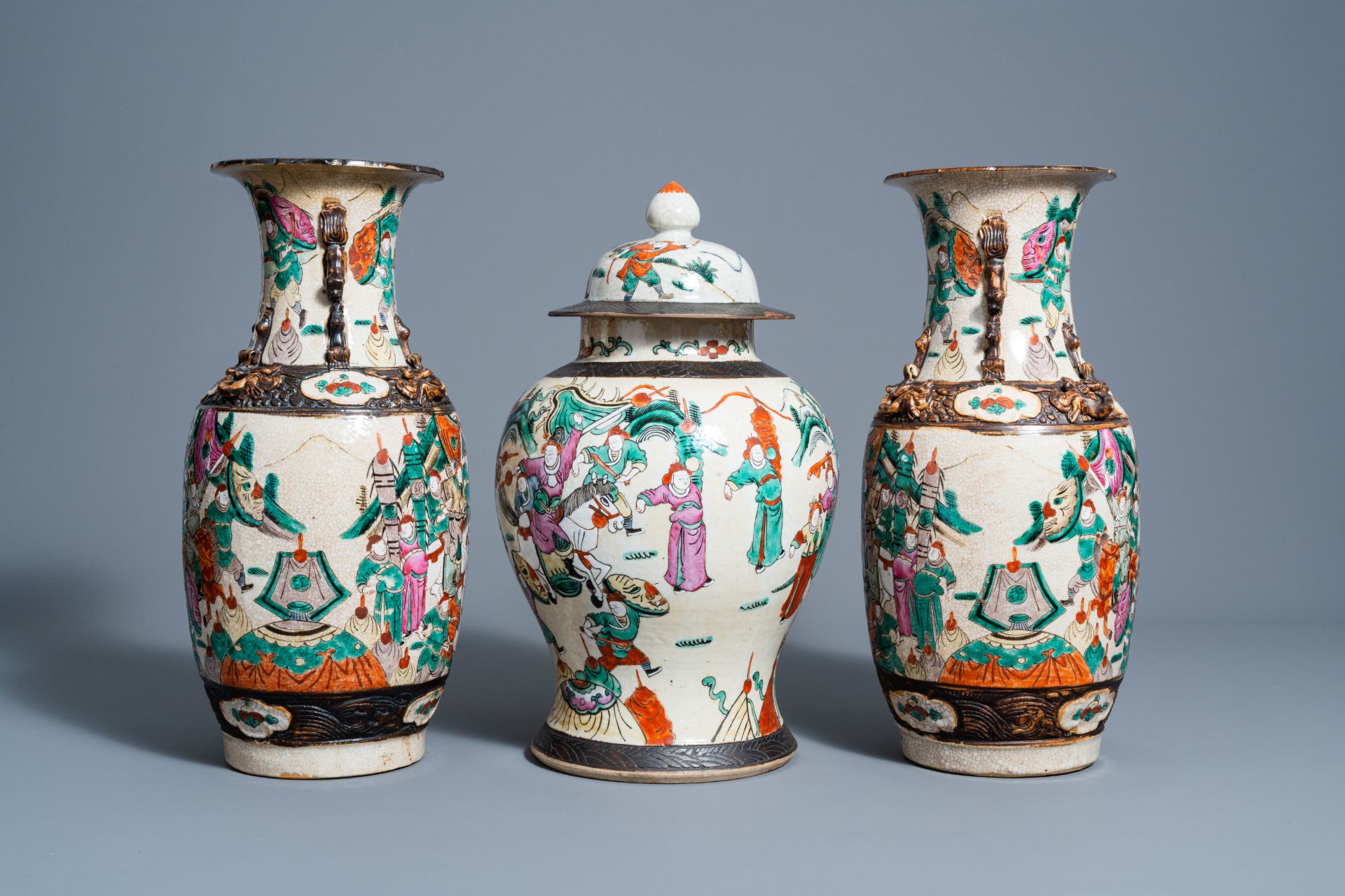 A pair of Chinese Nanking crackle glazed famille rose vases and a vase and cover with warrior scenes - Image 3 of 7