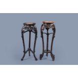 Two Chinese carved wood stands with marble top, 19th/20th C.