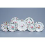 Seven Chinese famille rose and Imari style plates with floral design and a deer among blossoming bra
