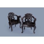A pair of Japanese carved wood 'dragon' chairs, 19th/20th C.