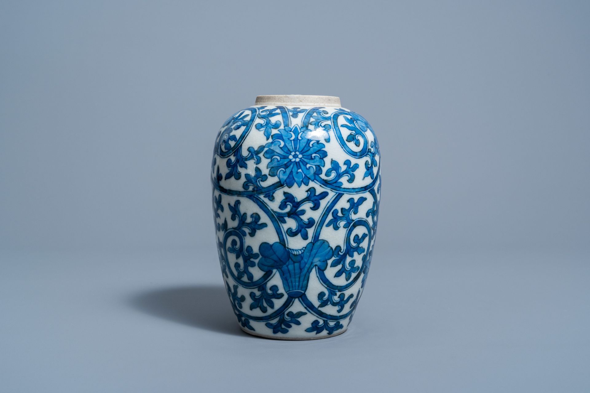 A Chinese blue and white 'lotus scrolls' jar, 19th C. - Image 4 of 7