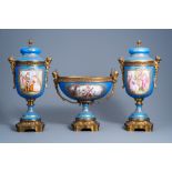 A French gilt bronze mounted 'bleu celeste' ground three-piece garniture with gallant scenes by Lepa