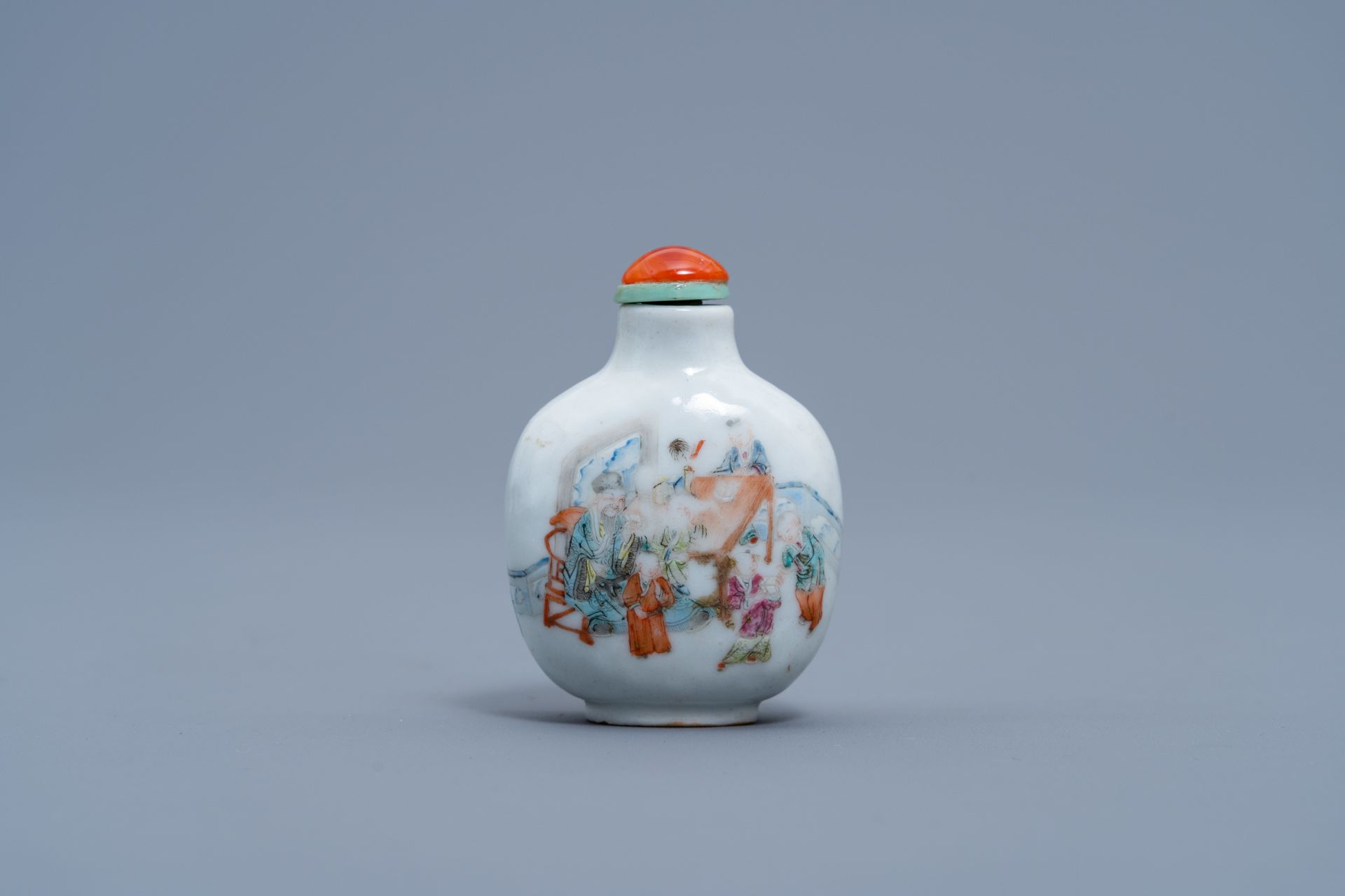 A Chinese famille rose snuff bottle with figures and animals in a garden, Daoguang mark and of the p